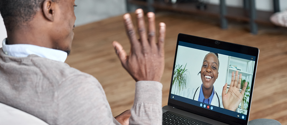 doctor and patient connecting via laptop through telehealth